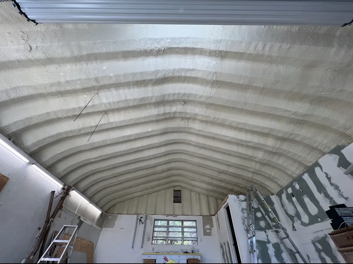 Spray polyurethane foam applied to the underside of a metal roof deck in Lampasas